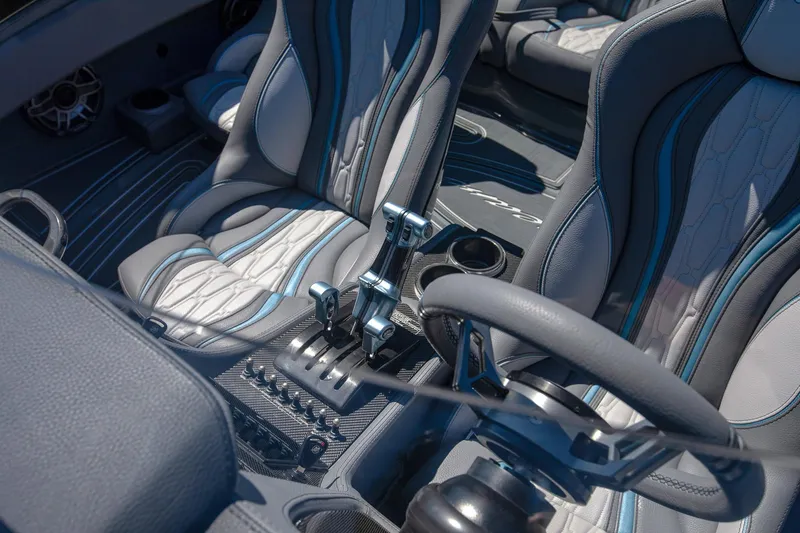 Slide: The Image of 2024 MTI 390X interior with sleek seats and modern controls. - 29