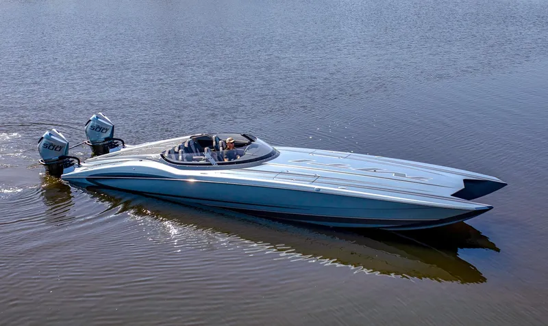 Slide: The Image of 2024 MTI 390X powerboat with dual engines cruising on calm water. - 3