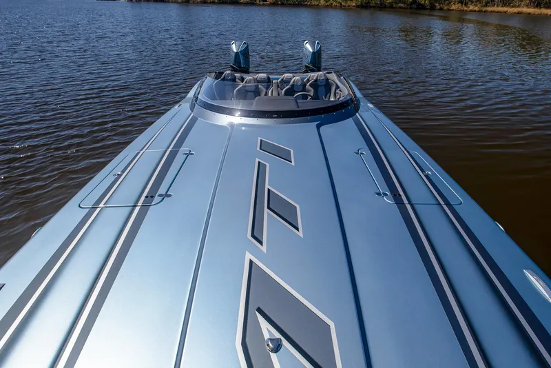 Slide: The Image of 2024 MTI 390X powerboat on water, showcasing sleek design and modern features. - 30