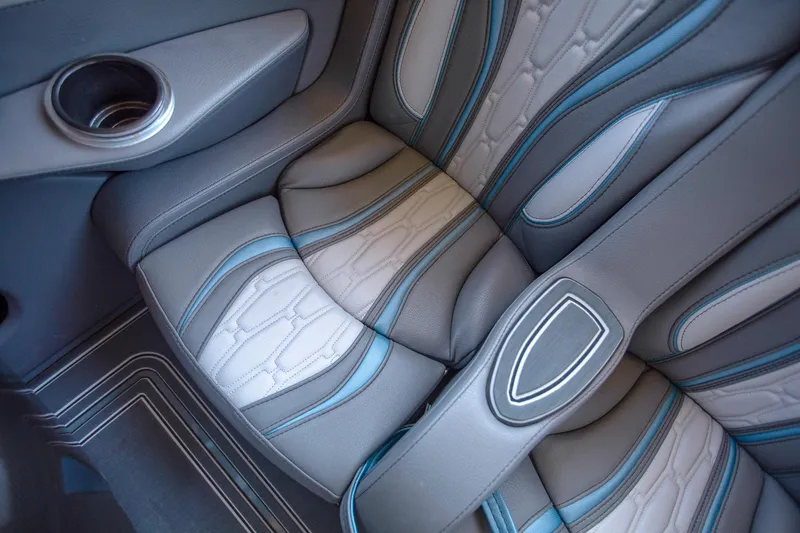 Slide: The Image of 2024 MTI 390X interior seat with blue accents and modern design. - 32