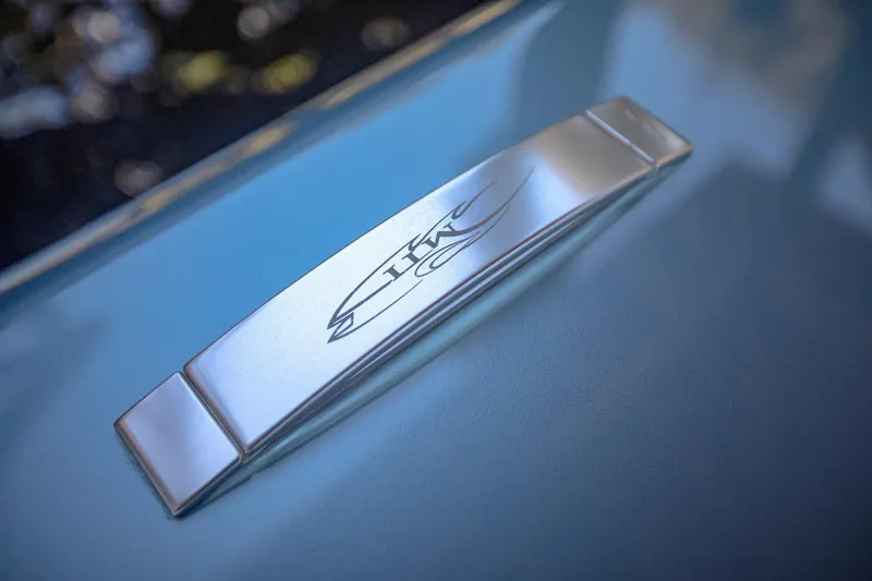 Slide: The Image of 2024 MTI 390X logo on sleek metallic surface. - 34