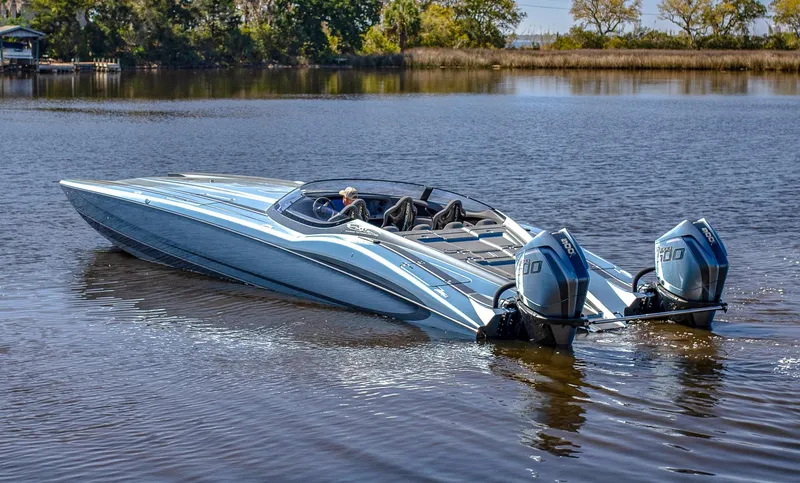 Slide: The Image of 2024 MTI 390X speedboat with dual engines on a calm lake. - 6