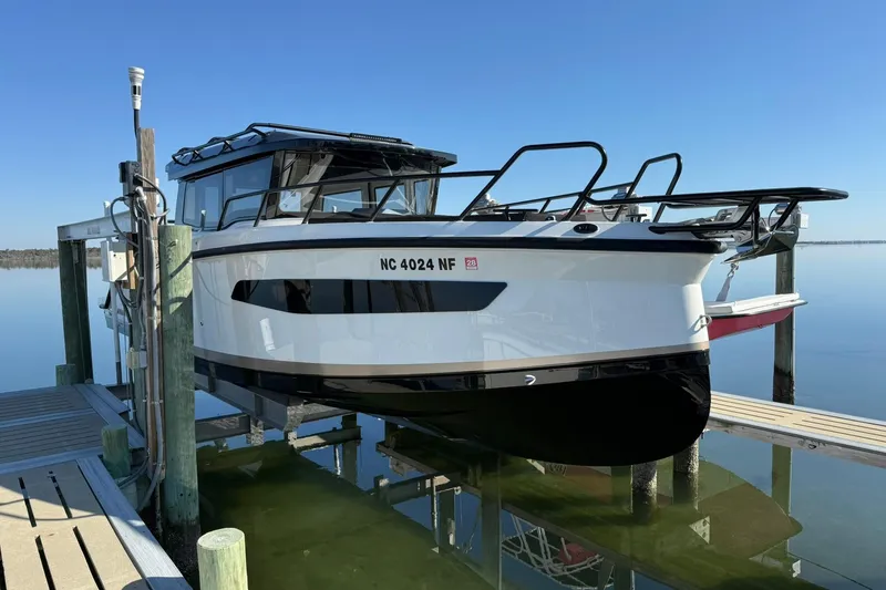 The Image of 2025 Navan C30 boat docked on calm water, showcasing sleek design and modern features. - 0