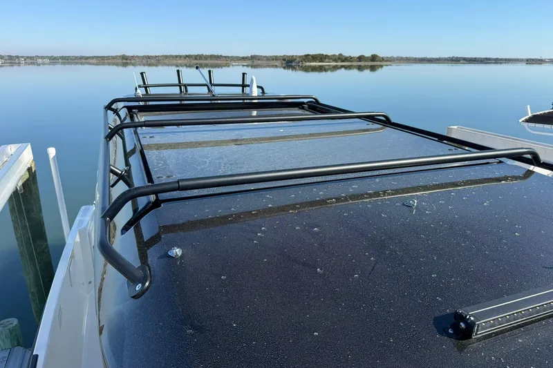 Slide: The Image of Rooftop view of 2025 Navan C30 boat with sleek design on calm water. - 10