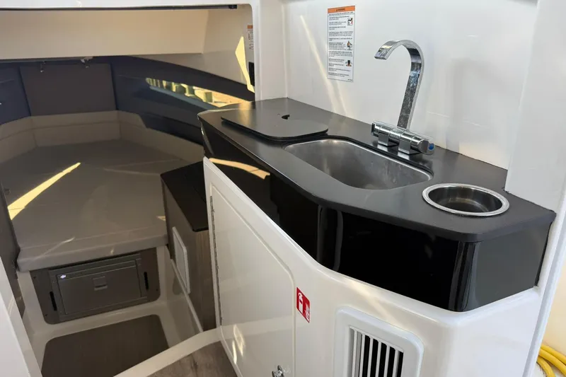 Slide: The Image of 2025 Navan C30 interior with modern kitchenette and cozy seating area. - 15