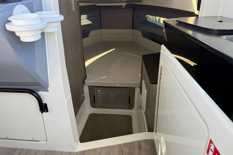 Slide: The Image of Interior cabin of 2025 Navan C30 boat, featuring modern design and compact storage. - 16