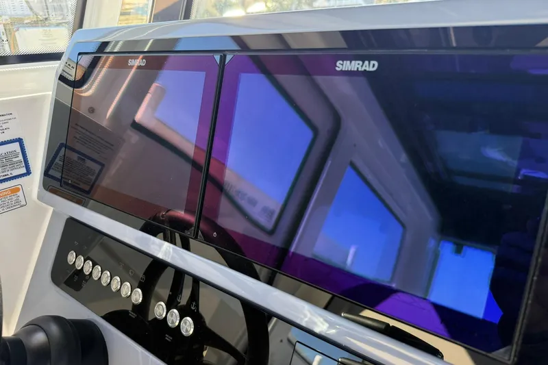 Slide: The Image of Simrad navigation system on 2025 Navan C30 boat dashboard. - 17