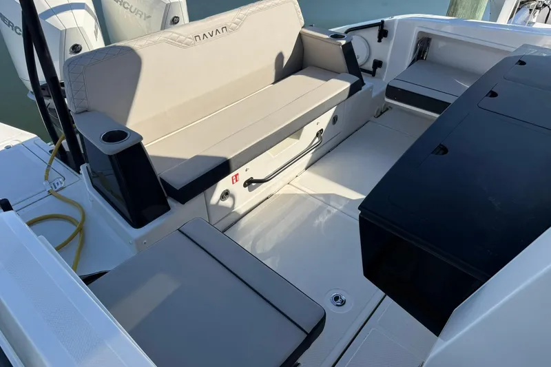 Slide: The Image of 2025 Navan C30 boat interior with beige seating and cup holders. - 35
