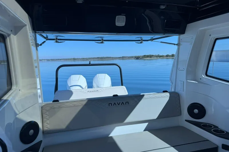 Slide: The Image of Interior view of 2025 Navan C30 boat with serene lake backdrop. - 36