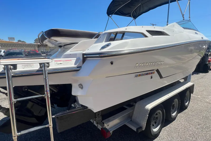 Slide: The Image of 2017 Monterey 298SS Super Sport boat on trailer, sunny day, rear view. - 12