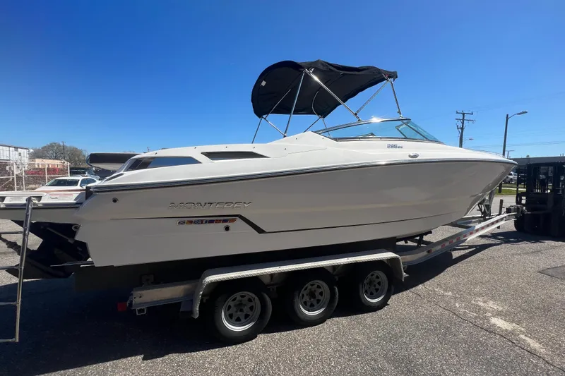 Slide: The Image of 2017 Monterey 298SS Super Sport boat on trailer under clear blue sky. - 14