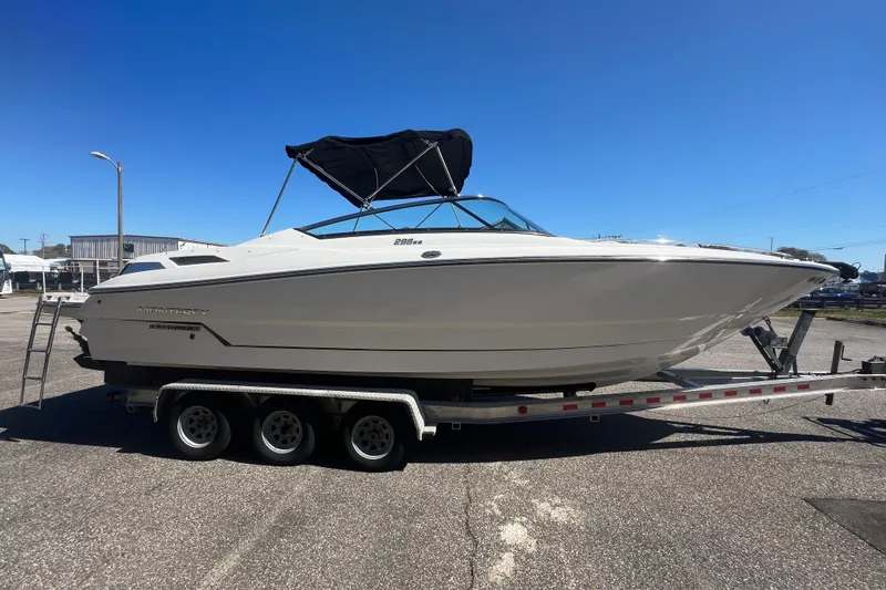 Slide: The Image of 2017 Monterey 298SS Super Sport boat on trailer under clear blue sky. - 15