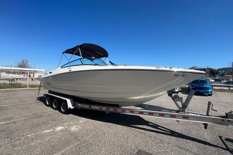 Slide: The Image of 2017 Monterey 298SS Super Sport boat on trailer under clear blue sky. - 17