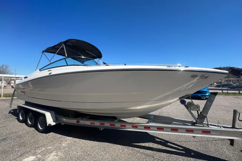 Slide: The Image of 2017 Monterey 298SS Super Sport boat on trailer under clear blue sky. - 18