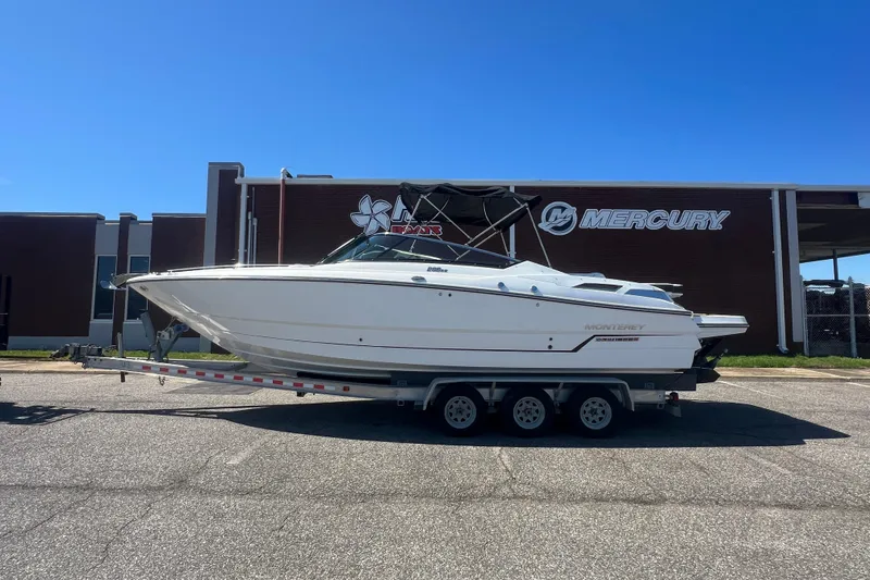 Slide: The Image of 2017 Monterey 298SS Super Sport boat on trailer, parked outside Mercury building. - 2