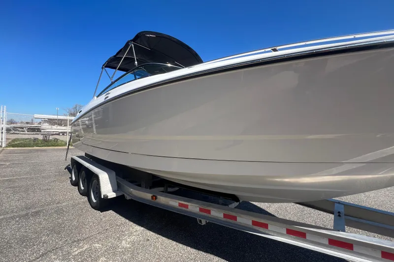 Slide: The Image of 2017 Monterey 298SS Super Sport boat on trailer under clear blue sky. - 20