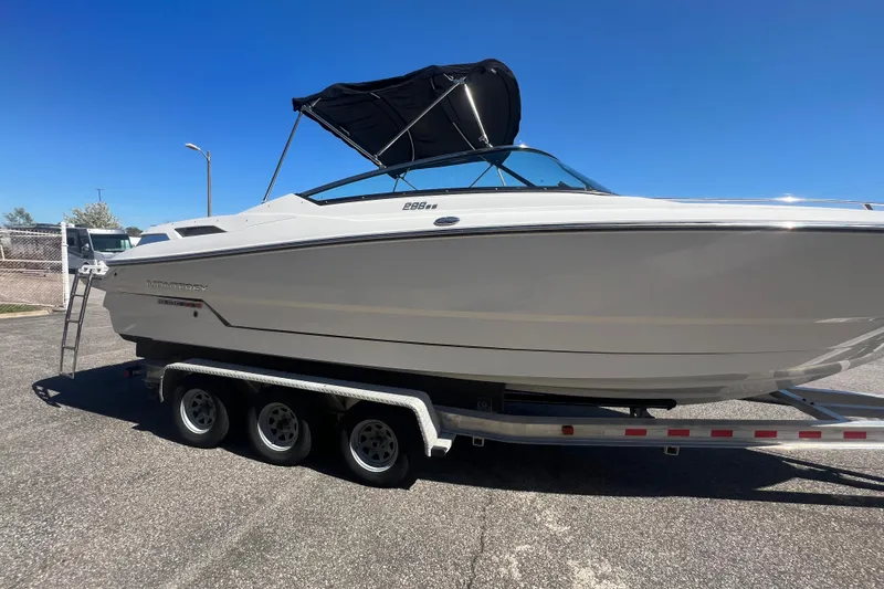 Slide: The Image of 2017 Monterey 298SS Super Sport boat on a trailer under clear blue sky. - 21