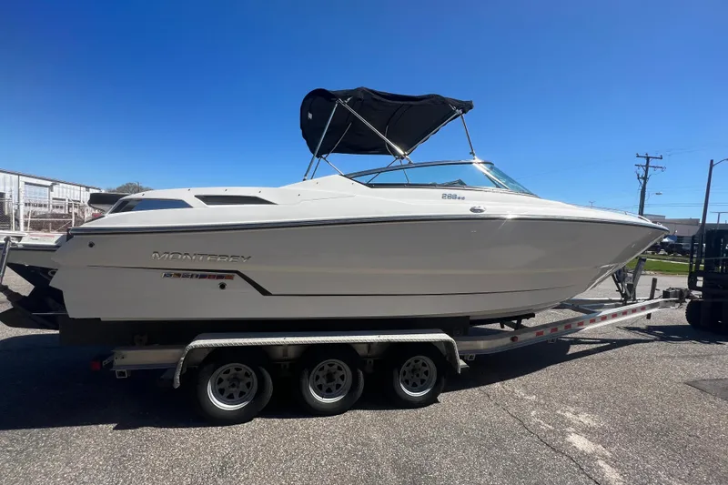 Slide: The Image of 2017 Monterey 298SS Super Sport boat on trailer under clear blue sky. - 22