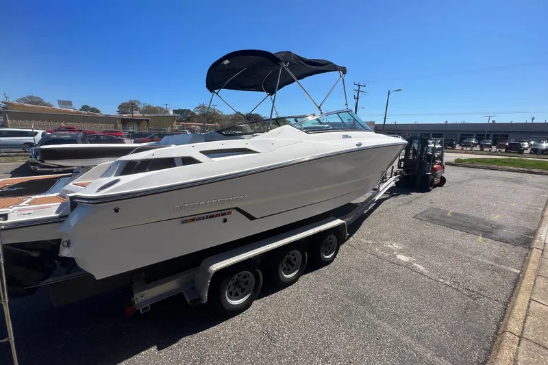 Slide: The Image of 2017 Monterey 298SS Super Sport boat on trailer in parking lot. - 23
