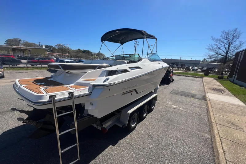 Slide: The Image of 2017 Monterey 298SS Super Sport boat on trailer, parked outdoors under clear blue sky. - 24