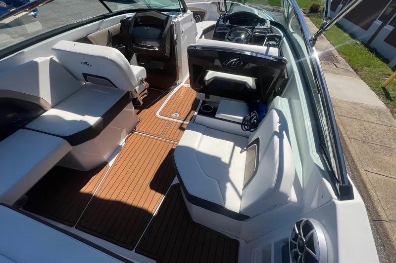 Slide: The Image of Interior of a 2017 Monterey 298SS Super Sport boat with sleek seating and wood flooring. - 28