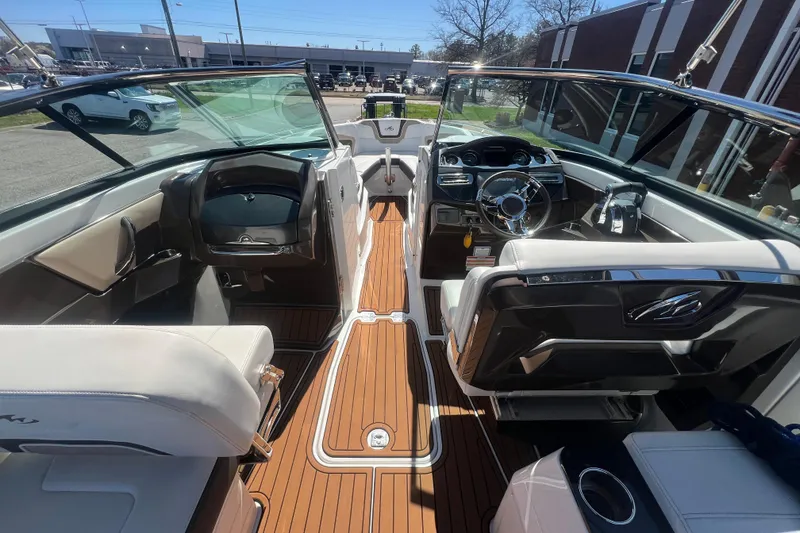 Slide: The Image of Interior view of a 2017 Monterey 298SS Super Sport boat with luxurious seating and dashboard. - 29