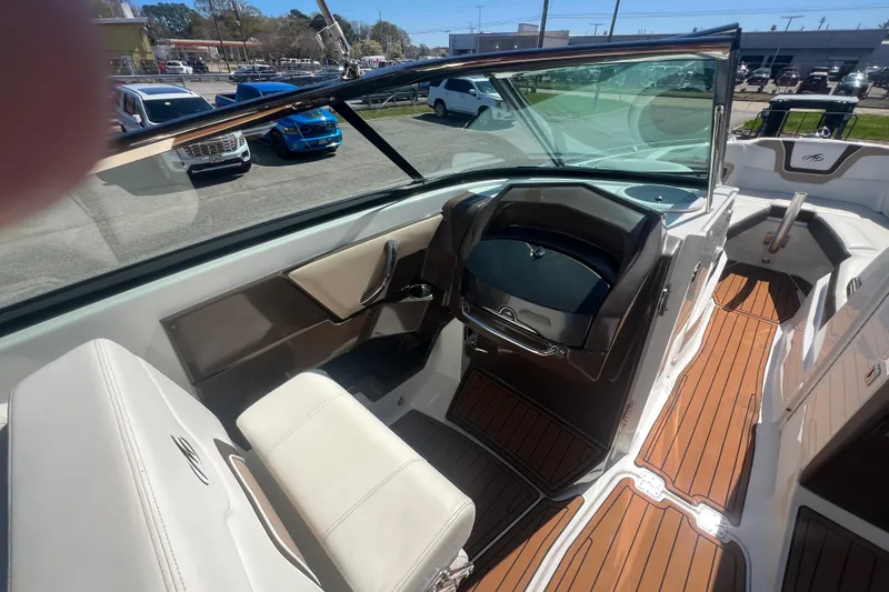 Slide: The Image of Interior of a 2017 Monterey 298SS Super Sport boat with sleek seating and wood flooring. - 32