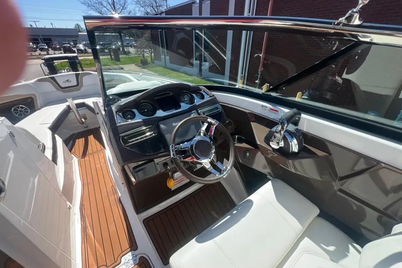 Slide: The Image of Interior view of a 2017 Monterey 298SS Super Sport boat cockpit with steering wheel. - 33