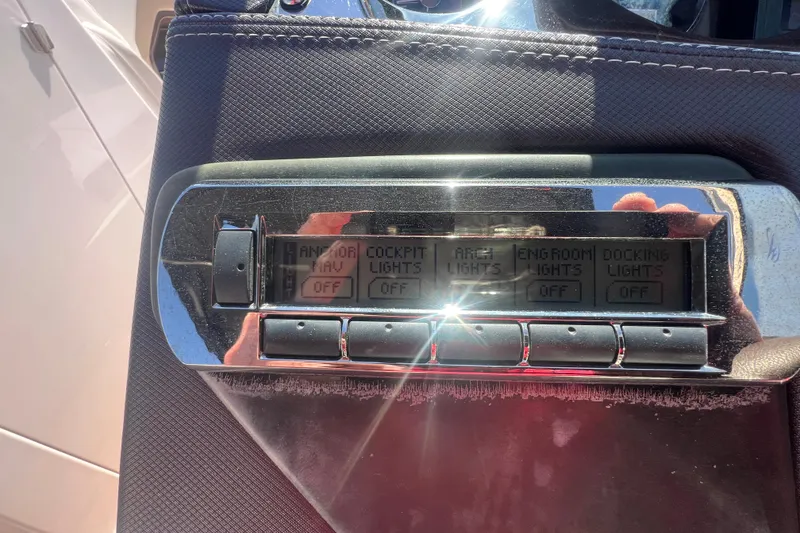 Slide: The Image of Control panel of a 2017 Monterey 298SS Super Sport boat with various light switches. - 34