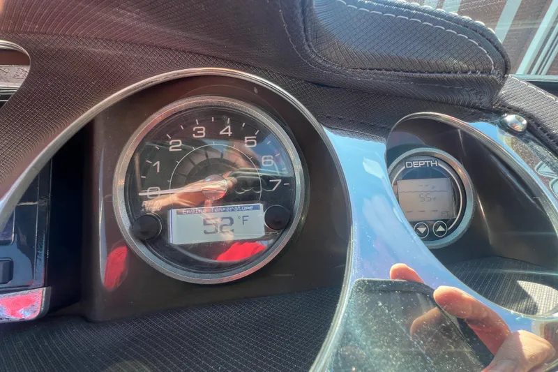 Slide: The Image of Dashboard of a 2017 Monterey 298SS Super Sport showing RPM and depth gauges. - 37