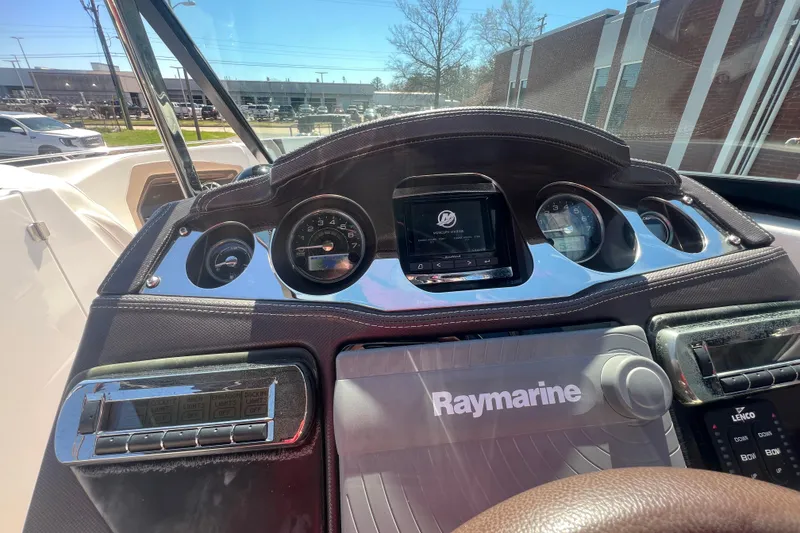 Slide: The Image of Dashboard of a 2017 Monterey 298SS Super Sport boat with Raymarine equipment. - 38