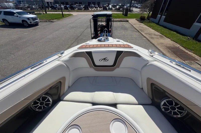 Slide: The Image of 2017 Monterey 298SS Super Sport boat interior with white seating and speakers. - 39