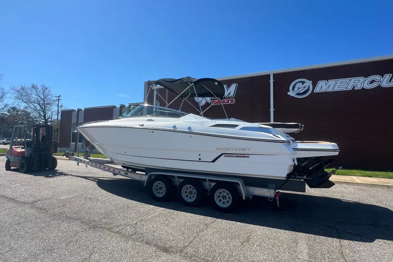 Slide: The Image of 2017 Monterey 298SS Super Sport boat on trailer, parked outside a building. - 4