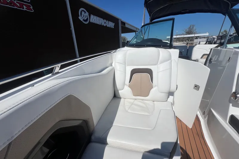 Slide: The Image of 2017 Monterey 298SS Super Sport boat interior with white seating and wood flooring. - 42