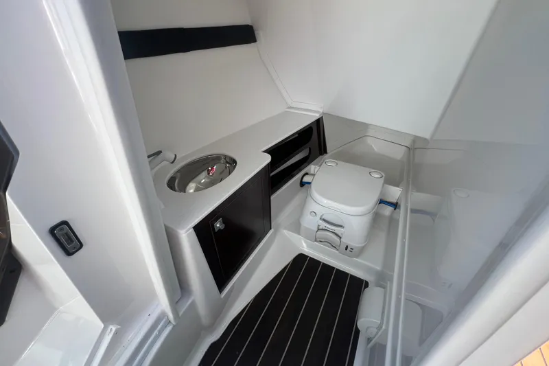 Slide: The Image of Interior of 2017 Monterey 298SS Super Sport boat bathroom with sink and toilet. - 47