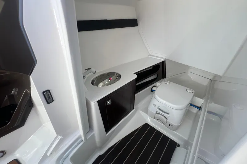Slide: The Image of Interior of 2017 Monterey 298SS Super Sport boat with sink and toilet. - 48