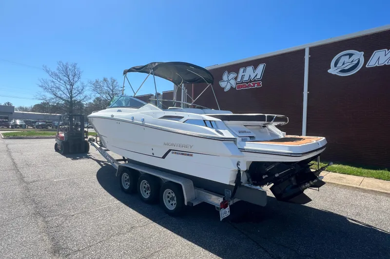 Slide: The Image of 2017 Monterey 298SS Super Sport boat on trailer outside HM Boats building. - 5