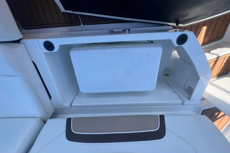 Slide: The Image of Storage compartment on a 2017 Monterey 298SS Super Sport boat with integrated cooler. - 52