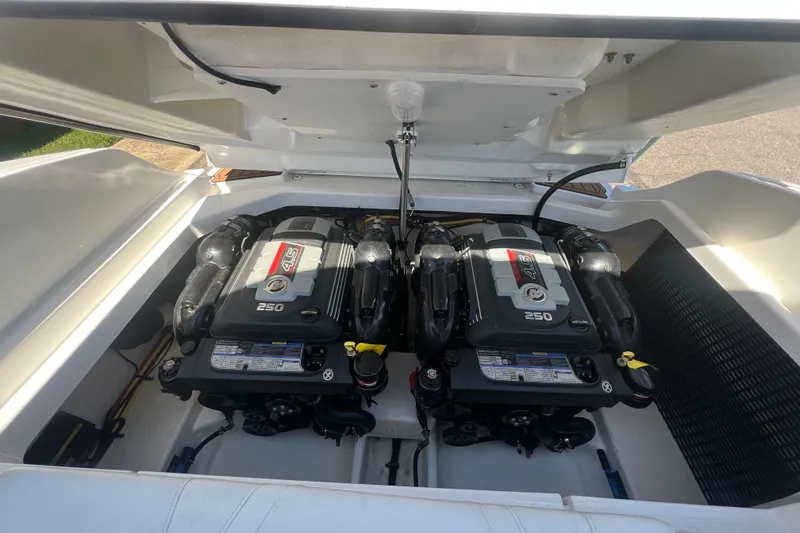 Slide: The Image of Engine compartment of a 2017 Monterey 298SS Super Sport boat, featuring dual 4.5L engines. - 53