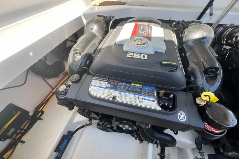 Slide: The Image of Engine compartment of a 2017 Monterey 298SS Super Sport boat, featuring a Mercury 4.5L 250 engine. - 54