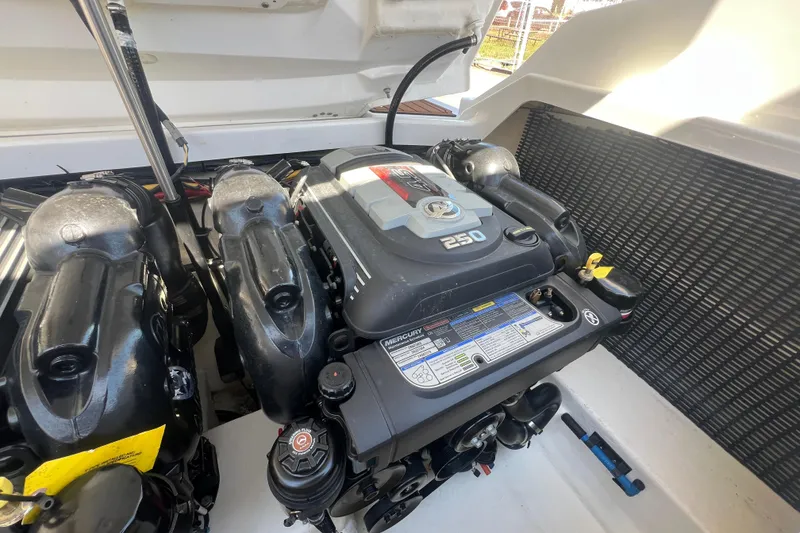 Slide: The Image of Engine compartment of a 2017 Monterey 298SS Super Sport boat, featuring a Mercury 250 engine. - 55