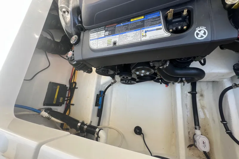 Slide: The Image of Engine compartment of a 2017 Monterey 298SS Super Sport boat, showcasing mechanical components. - 56
