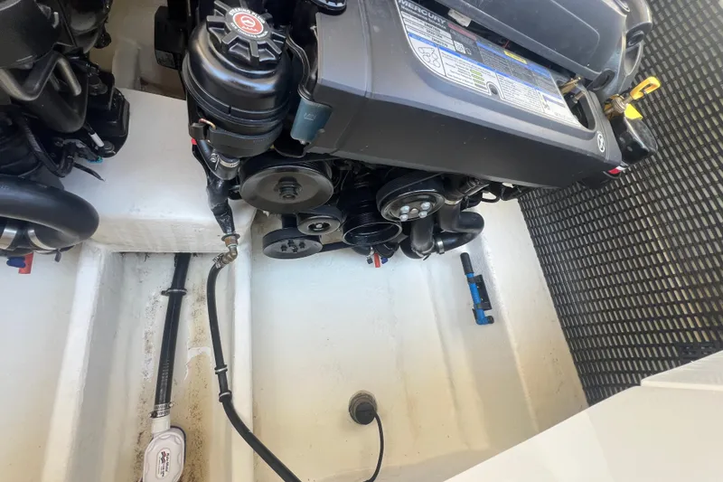 Slide: The Image of Engine compartment of a 2017 Monterey 298SS Super Sport boat, showcasing mechanical components. - 57
