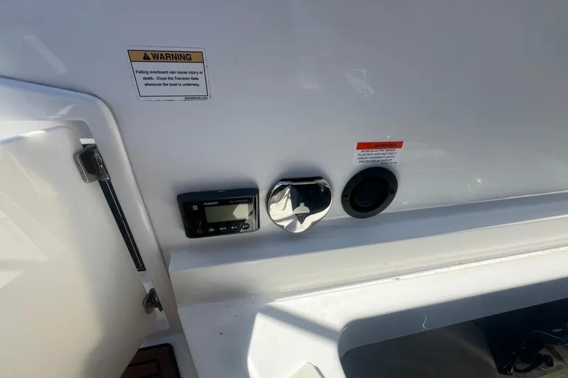 Slide: The Image of Control panel and warning labels on a 2017 Monterey 298SS Super Sport boat. - 59