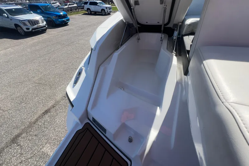Slide: The Image of 2017 Monterey 298SS Super Sport boat interior with open storage compartment. - 62