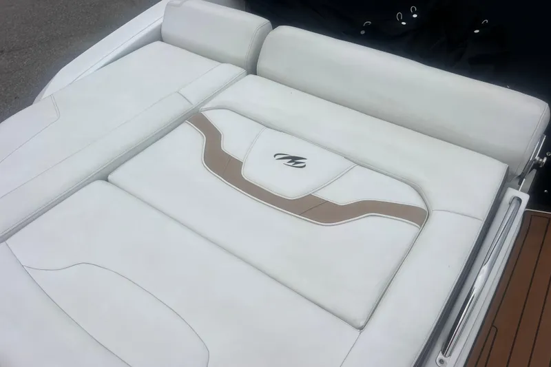 Slide: The Image of Luxurious seating on a 2017 Monterey 298SS Super Sport boat, featuring white and tan upholstery. - 64