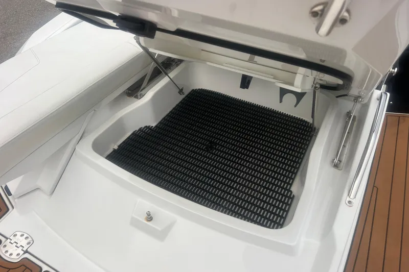 Slide: The Image of Open storage compartment on a 2017 Monterey 298SS Super Sport boat. - 67