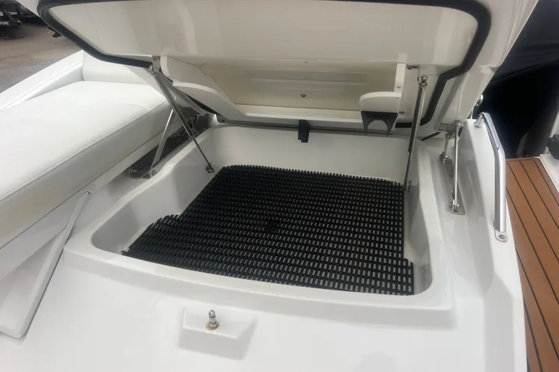Slide: The Image of Open storage compartment on a 2017 Monterey 298SS Super Sport boat. - 68