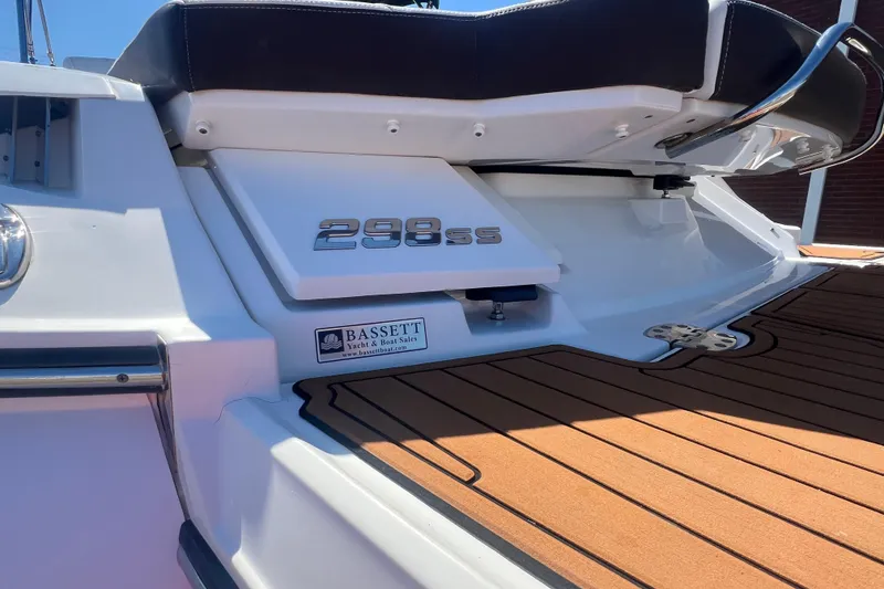 Slide: The Image of 2017 Monterey 298SS Super Sport boat rear view with teak deck and branding. - 8