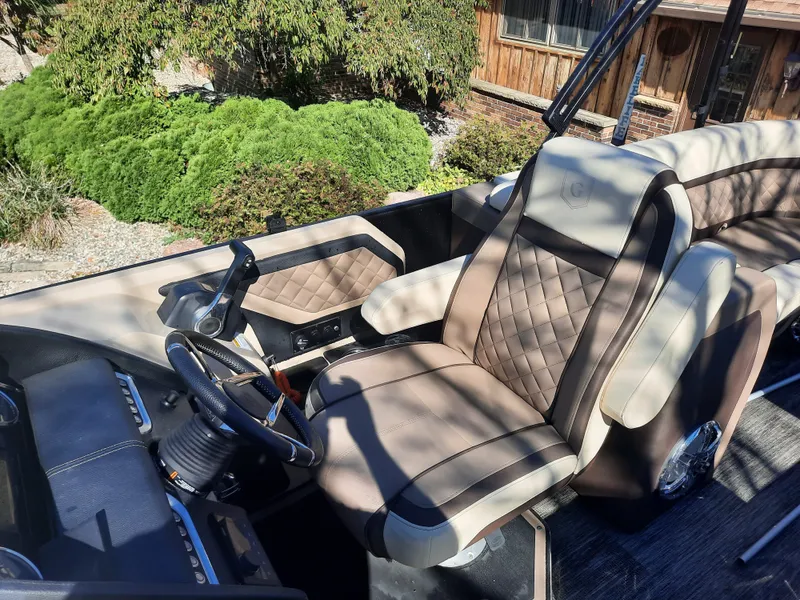 Slide: The Image of Interior of a 2022 Godfrey 23ft Tritoon boat with luxurious seating. - 2